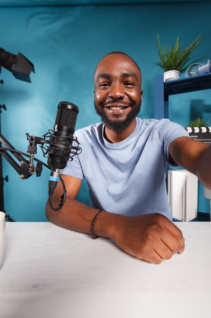 Content creator recording with a studio microphone